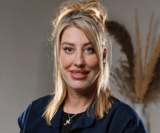 Mandi, Patient Care Coordinator at Sale Dental Spa, smiling warmly in the practice — helping patients with Invisalign, composite bonding, and teeth whitening in Sale, South Manchester.