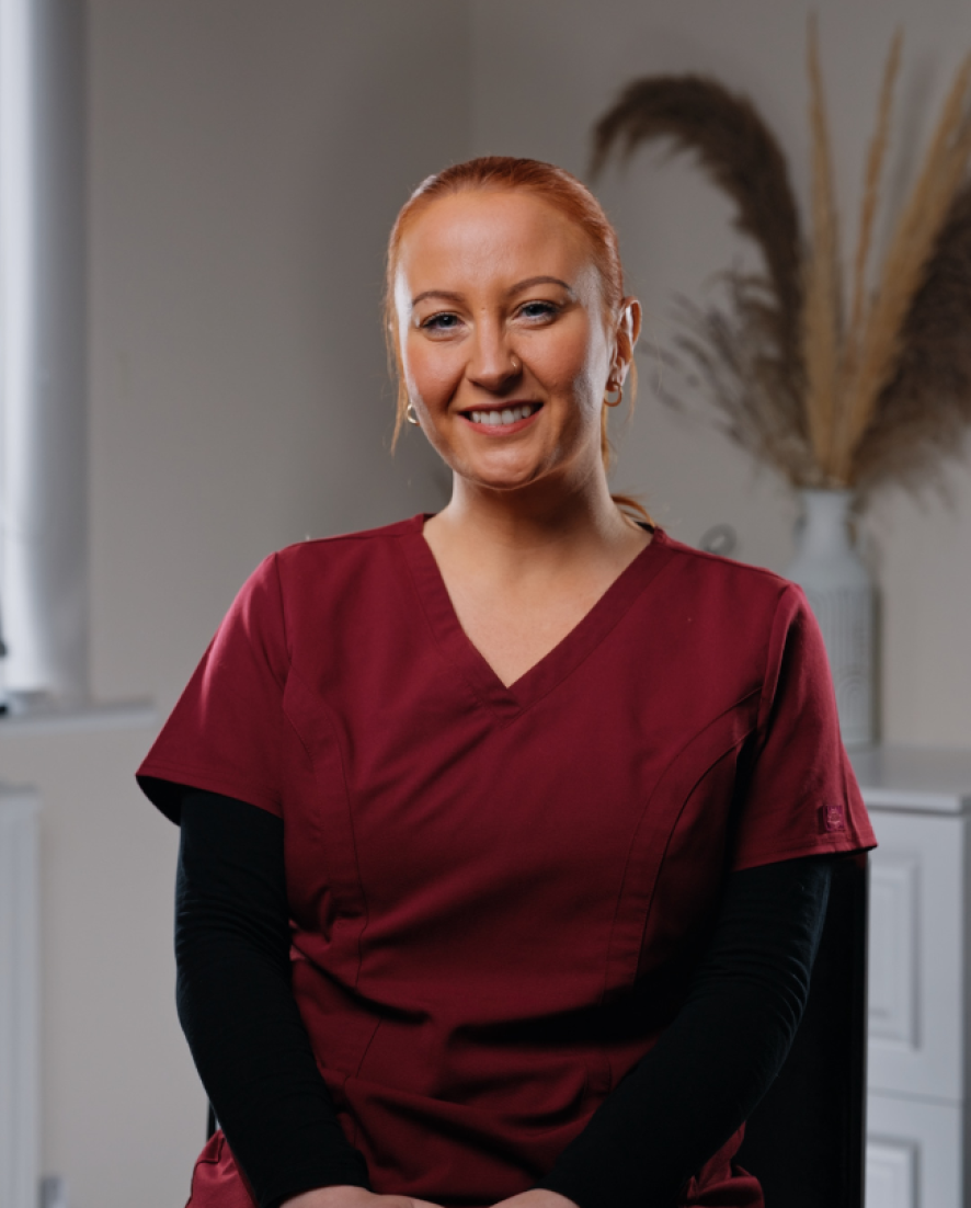 Rachael, Qualified Dental Nurse at Sale Dental Spa, smiling in the practice — supporting patients through Invisalign, composite bonding, and teeth whitening treatments in Sale, South Manchester.