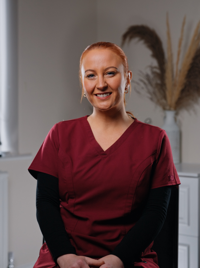 Rachael, Qualified Dental Nurse at Sale Dental Spa, smiling in the practice — supporting patients through Invisalign, composite bonding, and teeth whitening treatments in Sale, South Manchester.