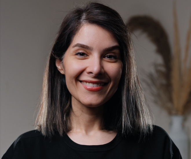 Yalda, Dental Therapist at Sale Dental Spa, smiling in the practice — providing hygiene treatments, preventive care, and professional teeth whitening in Sale, South Manchester.