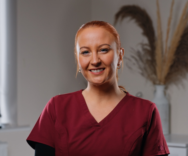Rachael, Qualified Dental Nurse at Sale Dental Spa, smiling in the practice — supporting patients through Invisalign, composite bonding, and teeth whitening treatments in Sale, South Manchester.