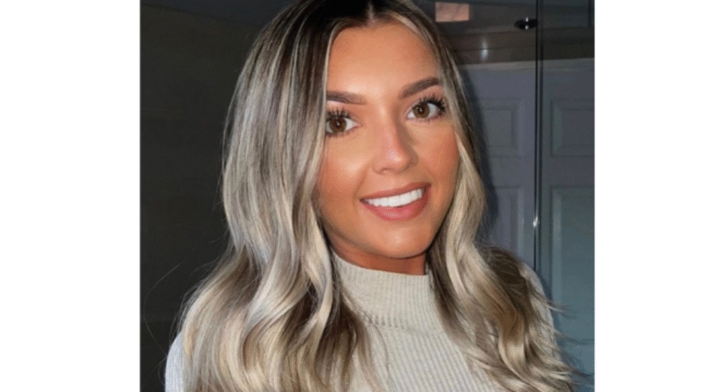 Patient with bright white smile after Boutique Whitening treatment at Sale Dental Spa in Manchester