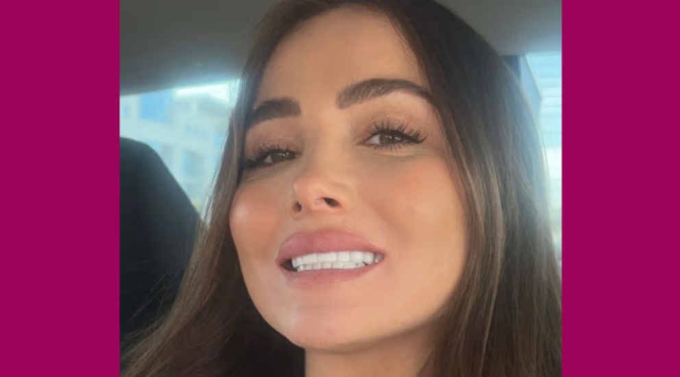 Woman covering mouth looking worried about dental problems after cosmetic dentistry abroad, illustrating risks of dental tourism